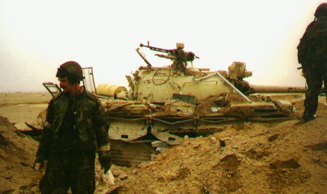  unknown 4-32 AR personnel near a destroyed Iraqi tank (photo probably taken during ground offensive 24-28 February 1991)